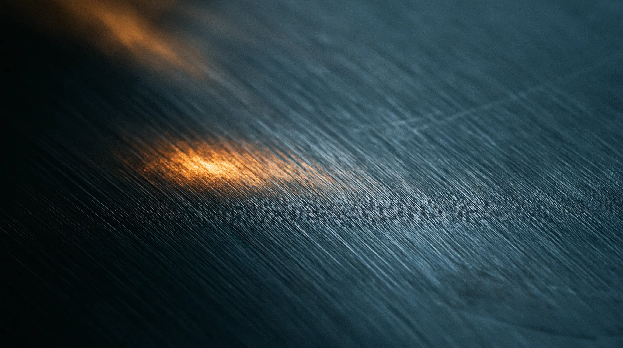 Close view of a dark steel surface.